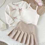 Cross-border Korean-style girls' and babies' school style bow tie cardigan with pure color camisole + A-line pleated skirt three-piece set